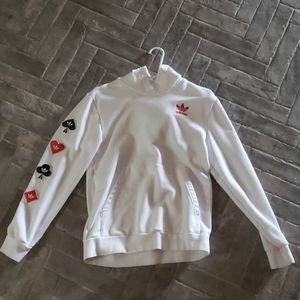 White Adidas sweatshirt with card suits on sleeve